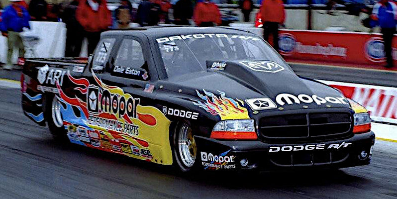Pro Stock Dodge Dakota vehicle with Mopar branding on a racetrack